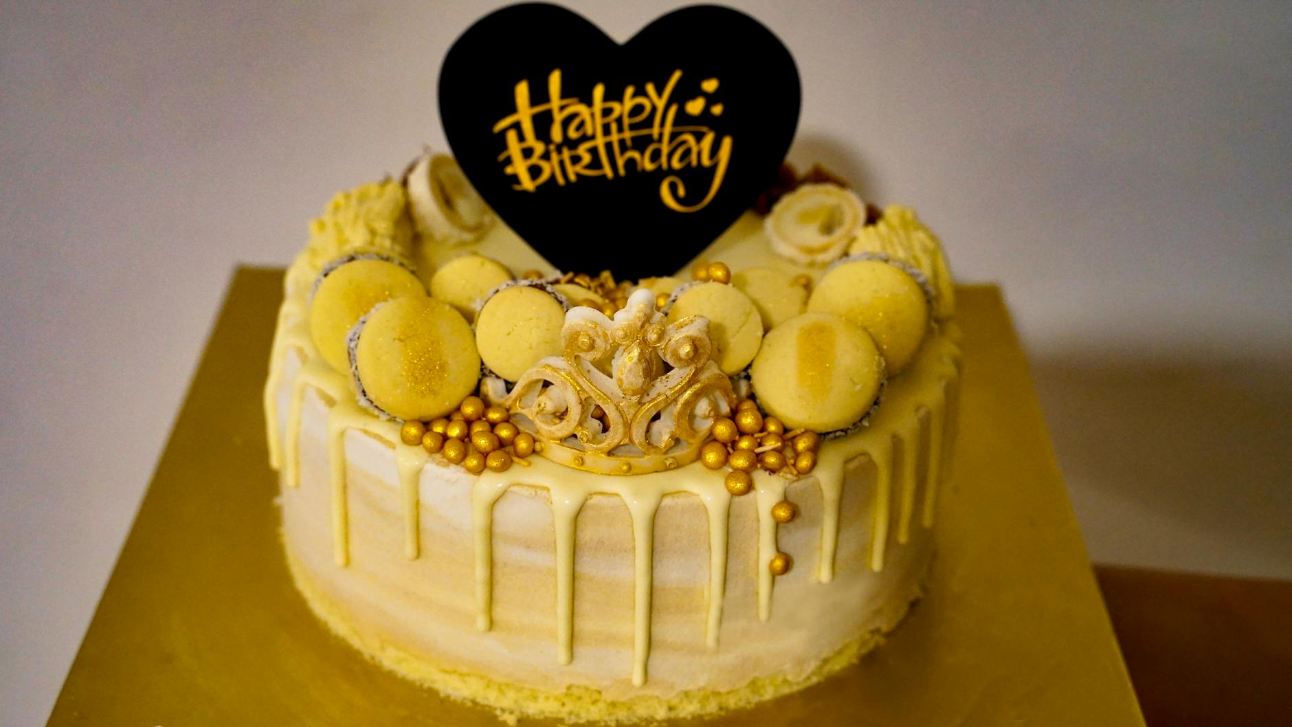 happy birthday cake with gold accent