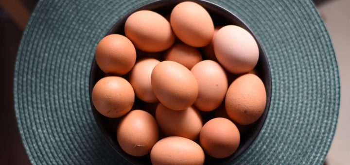 overhead shot of a bowl with brown eggs